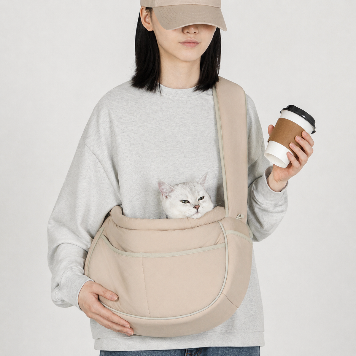 Cat traveling close to its owner in a crossbody sling