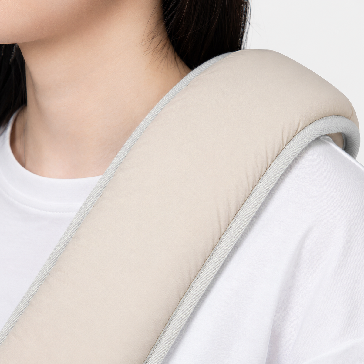 Close detail of a wide padded pet carrier shoulder strap