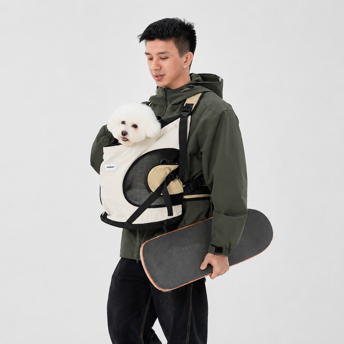 Small dog carried in a front pet backpack