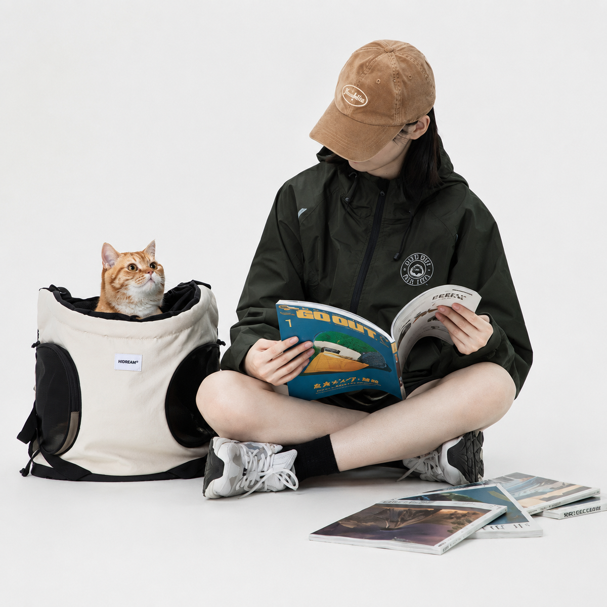 Cat sitting inside a structured pet carrier